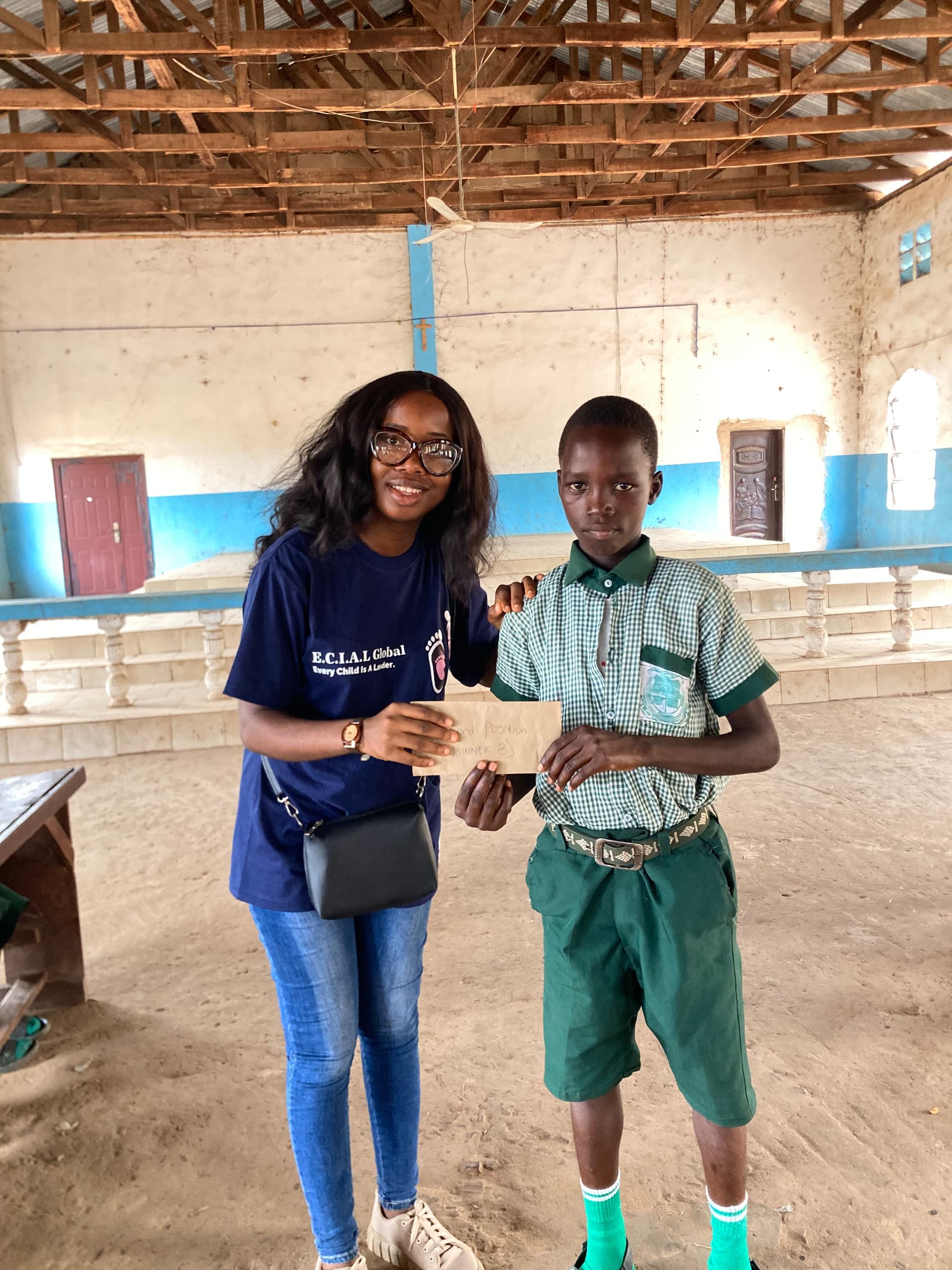 Emmanuella giving out a gift